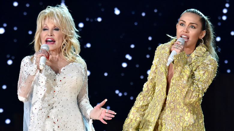 Dolly Parton and Miley Cyrus performing on stage together