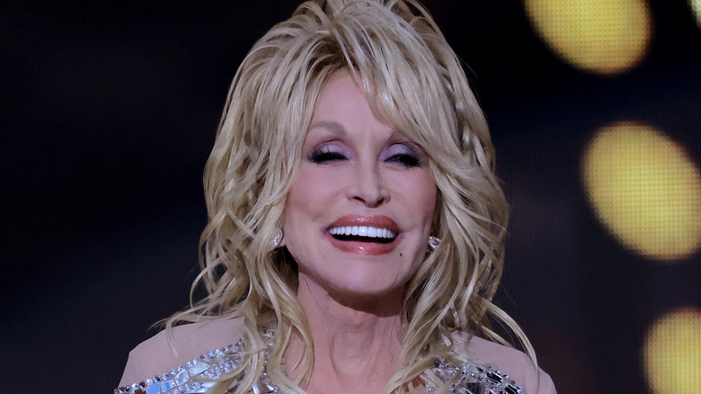 Dolly Parton smiles onstage