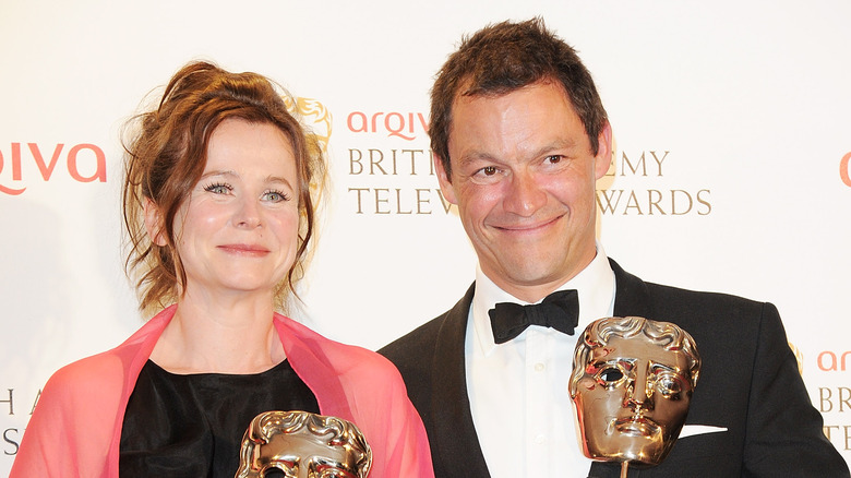 Emily Watson and Dominic West holding BAFTAs