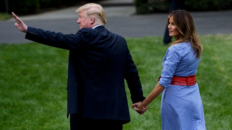 Donald and Melania Trump holding hands