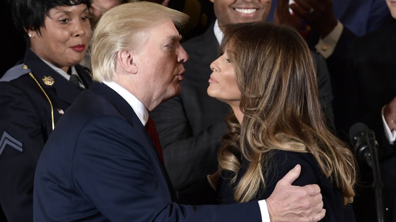 Donald and Melania Trump mid-kiss