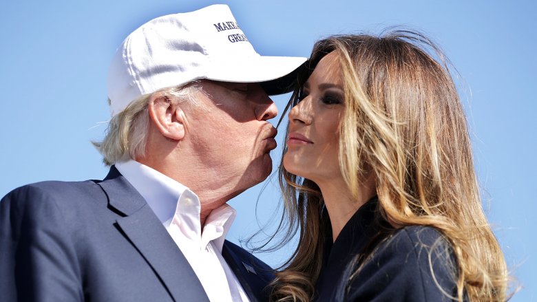 Donald and Melania Trump mid-kiss