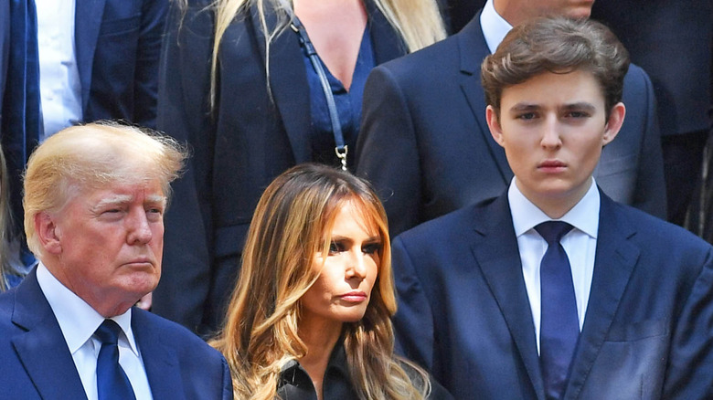 The Trump family with solemn expressions
