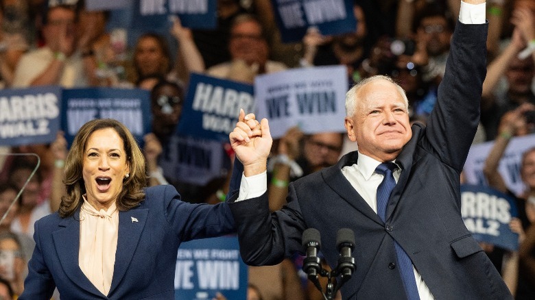 Kamala Harris and Tim Walz cheer on stage at a rally in Philadelphia, PA (2024)