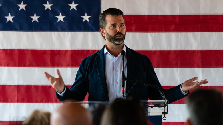 Donald Trump Jr. speaking during a campaign event with David Perdue