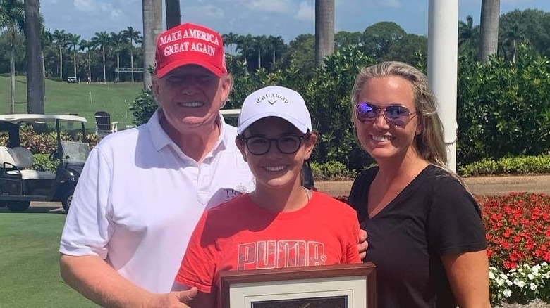 Donald Trump with granddaugher Kai Trump, Women's Club Champion at Trump International Golf Club