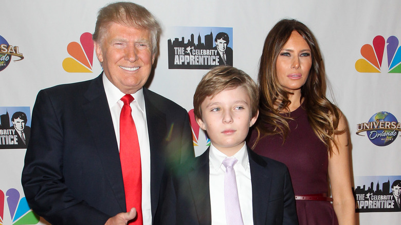 Donald, Barron, and Melania Trump posing