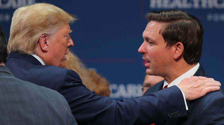 Donald Trump and Ron DeSantis talking