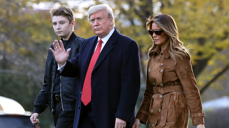 Barron Trump, Donald Trump, and Melania Trump walking