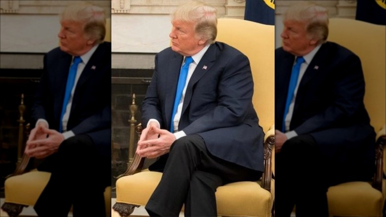 Donald Trump sitting with legs crossed