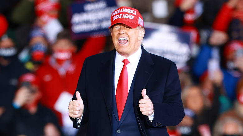 Donald Trump wearing a MAGA cap at rally