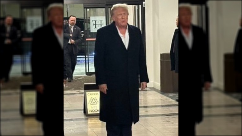 Donald Trump walking in lobby