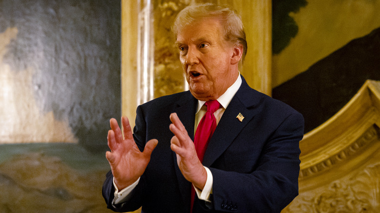 Donald Trump speaking with hands up