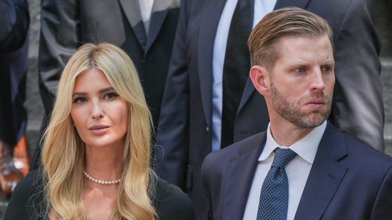 Ivanka Trump staring Eric trump looking to the side