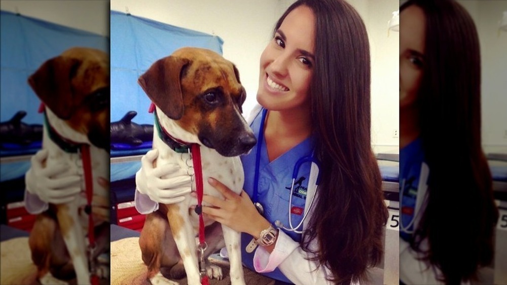 Dr. Jackie Duenas holding a dog