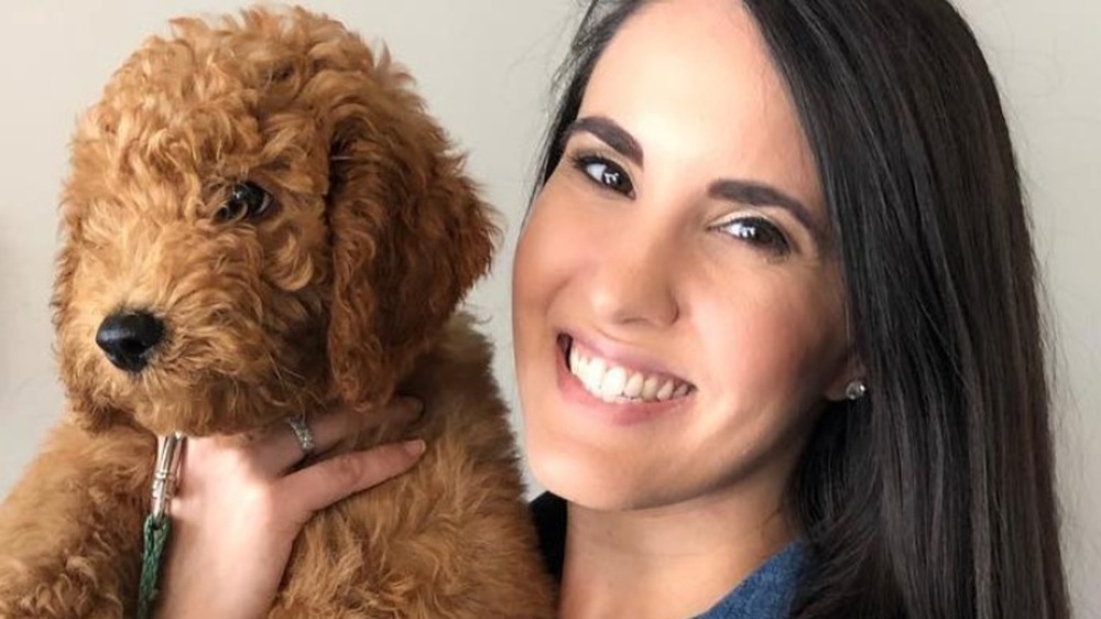 Dr. Jackie Duenas holding a dog