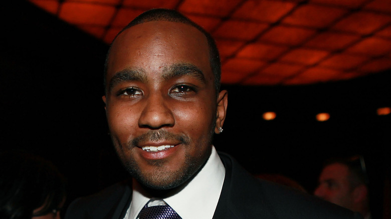 Nick Gordon posing at an event