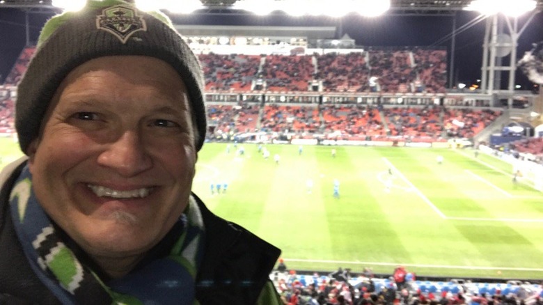 Drew Carey smiling at a Seattle Sounders FC Game