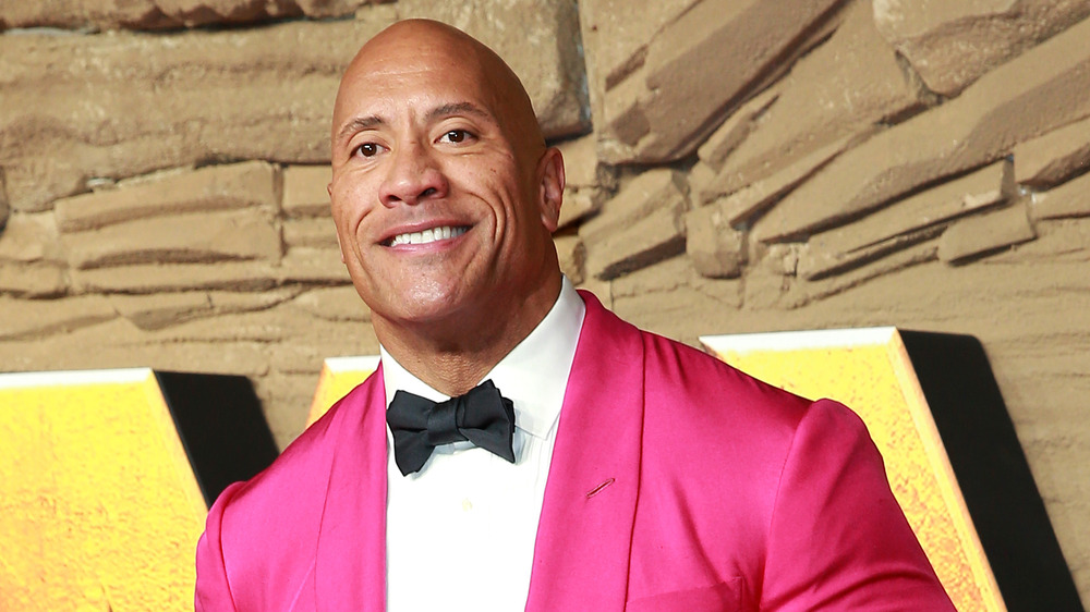 Dwayne Johnson wearing pink blazer