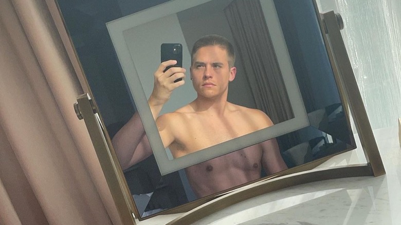 Dylan Sprouse posing for mirror selfie