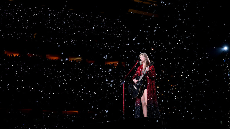 Taylor Swift surrounded by lights