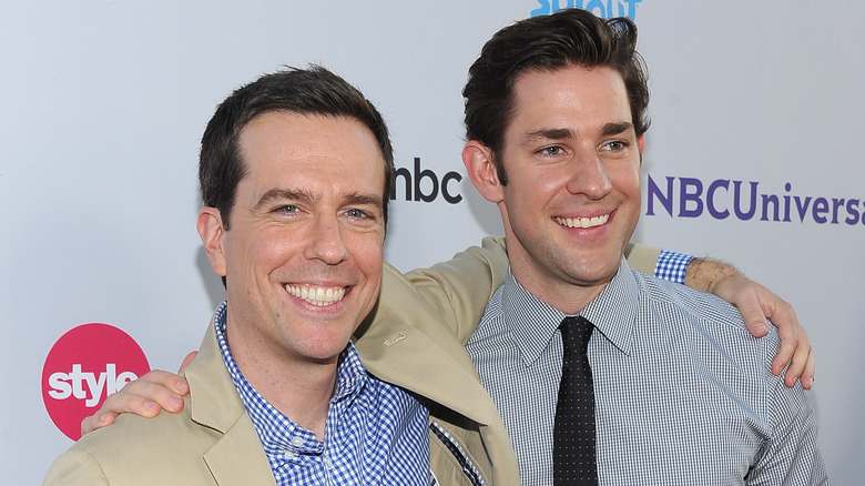 Ed Helms arm around John Krasinski