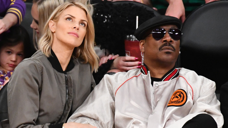 Paige Butcher and Eddie Murphy on sidelines 