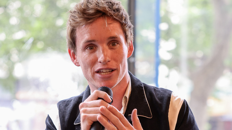 Eddie Redmayne speaking at event in 2022