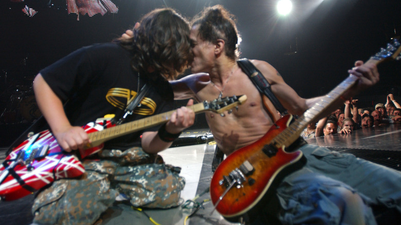 Wolfgang Van Halen and Eddie Van Halen performing