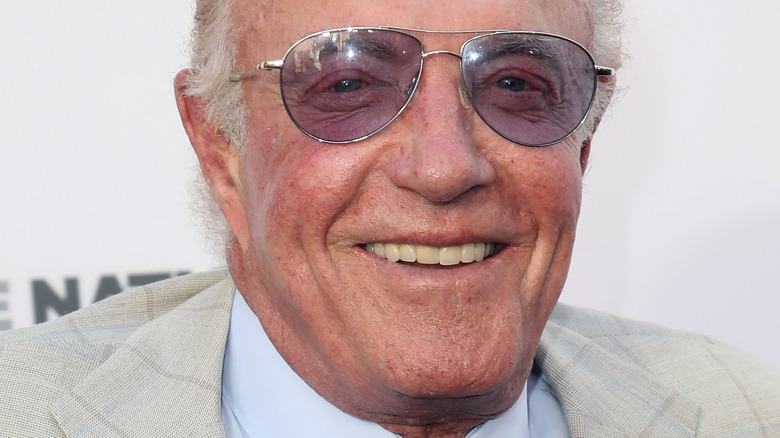 James Caan smiling in aviator shades