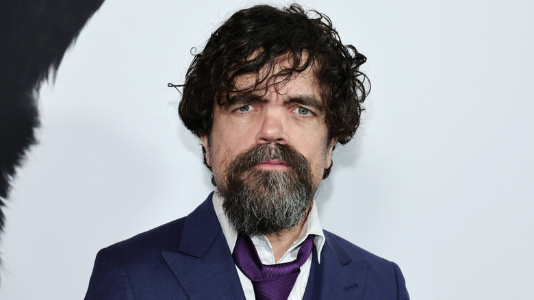 Peter Dinklage posing sternly at event