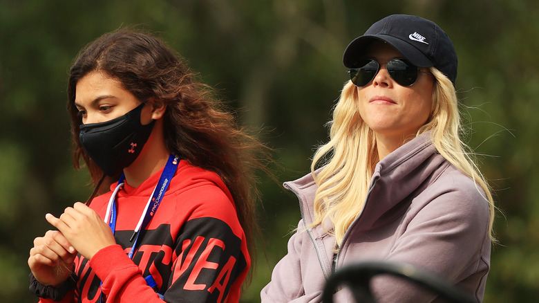 Elin Nordegren looks on next to her daughter Sam