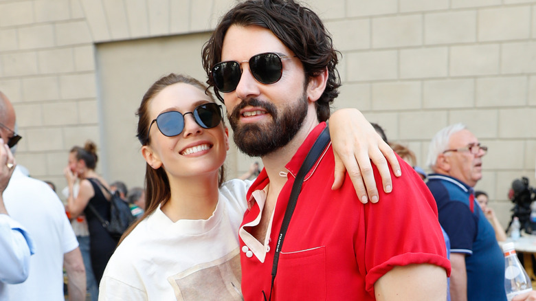 Elizabeth Olsen and Arnett in sunglasses