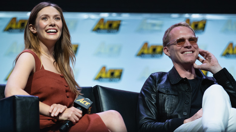 Elizabeth Olsen and Paul Bettany smiling