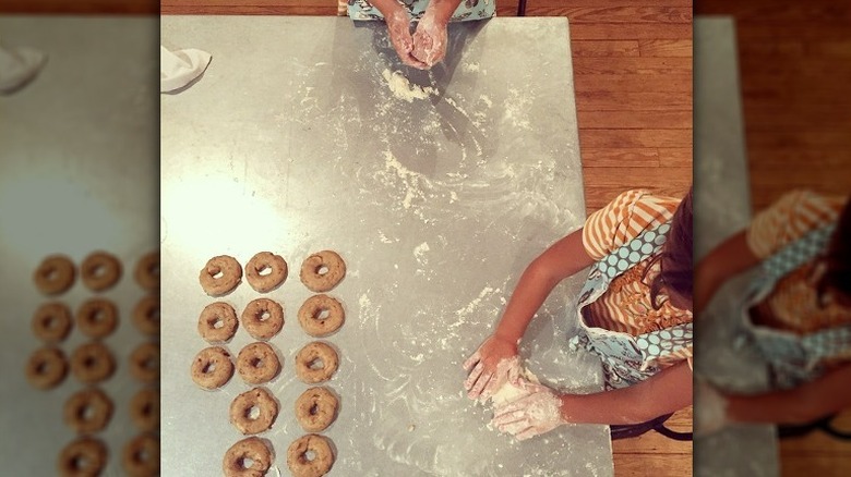 Ella and Emmie Gaines making donuts