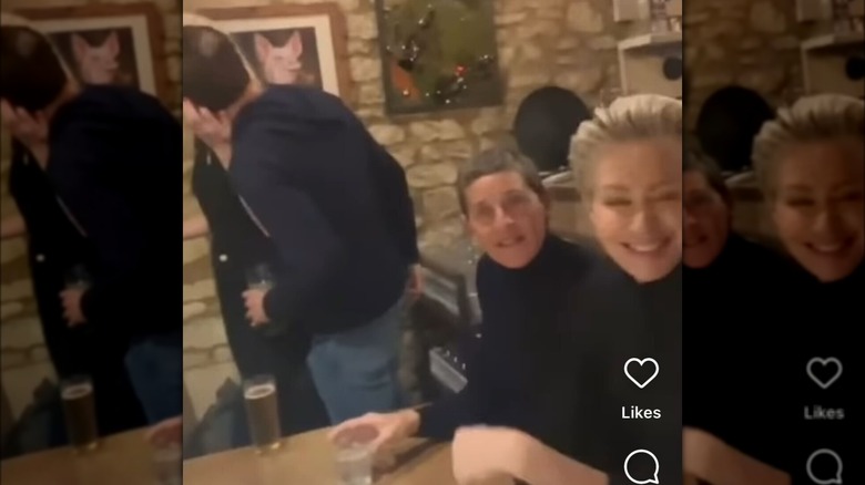 Ellen DeGeneres and wife Portia de Rossi wearing black at a pub