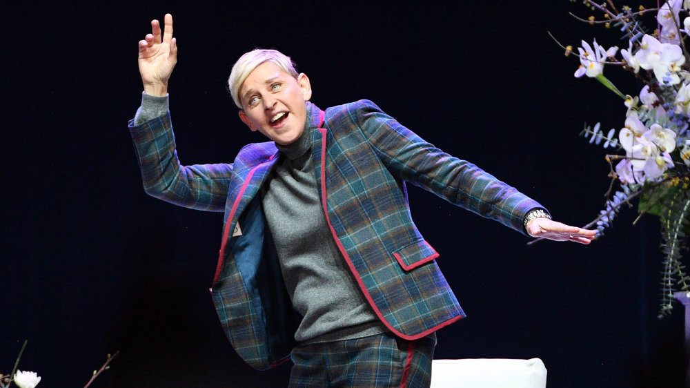 Ellen DeGeneres dancing in a turtleneck 