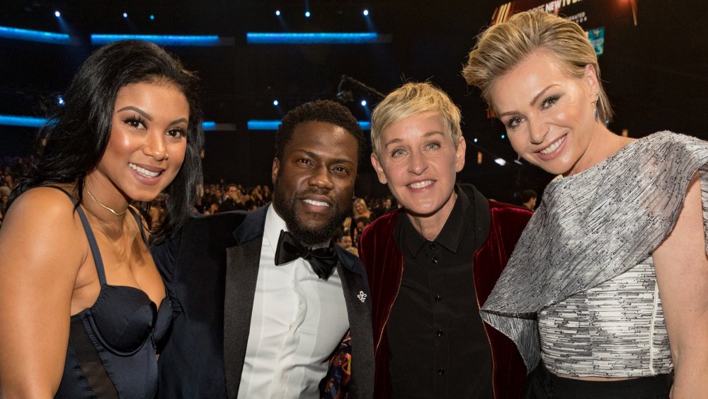 Eniko Hart, Kevin Hart, Ellen DeGeneres, Portia De Rossi smiling at an award show 