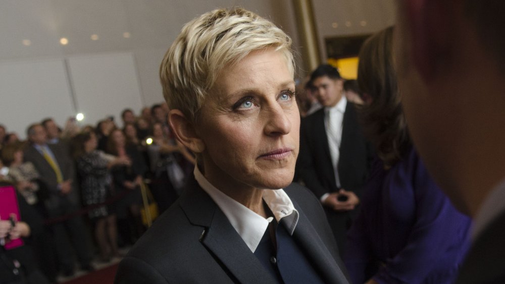 Ellen DeGeneres looking stern on a red carpet 
