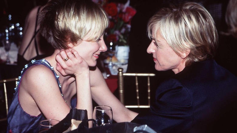 Anne Heche smiling at Ellen DeGeneres