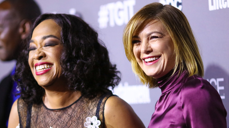 Ellen Pompeo laughing with Grey's Anatomy creator Shonda Rhimes