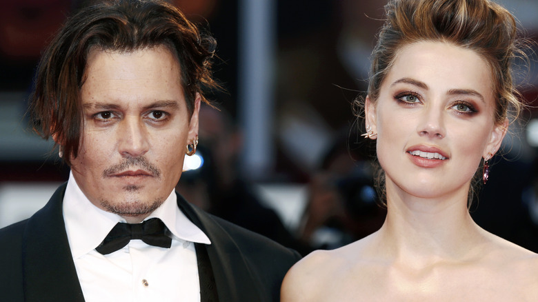 ohnny Depp and Amber Heard posing