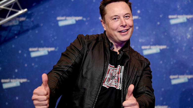 Elon Musk with his thumbs up