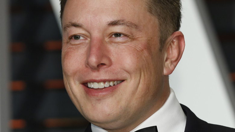 Elon Musk smiling tuxedo bow tie