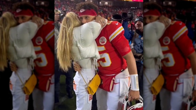 Patrick Mahomes wipes his mouth after kissing Brittany