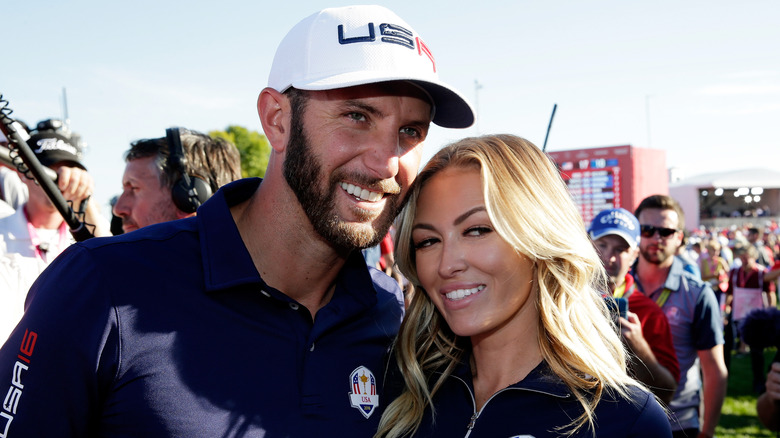 Dustin Johnson, Paulina Gretzky smiling outdoors