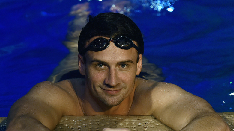 Ryan Lochte on edge of pool