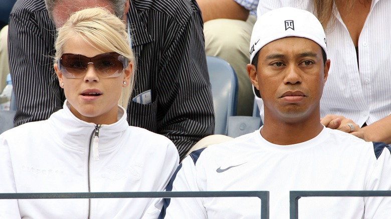 Elin Nordegren, Tiger Woods seated in crowd