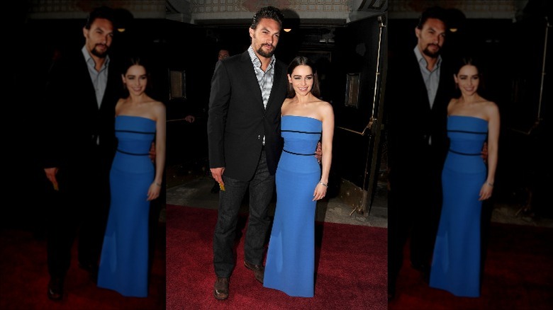 Jason Momoa and Emilia Clarke on a red carpet