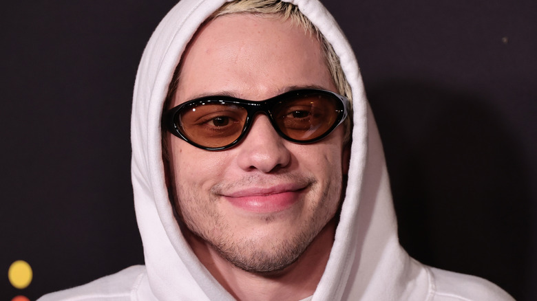 Pete Davidson smiling in sunglasses